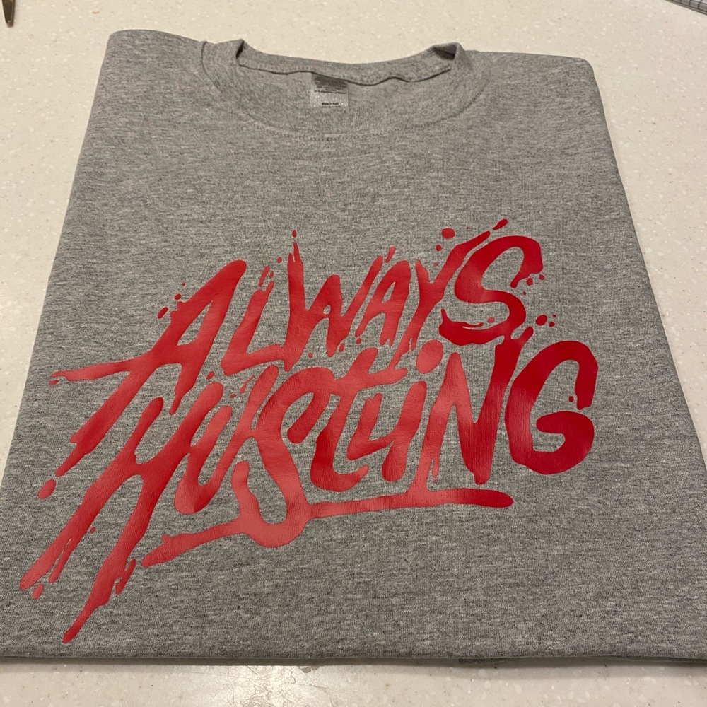 Always hustling “ brand new tee.